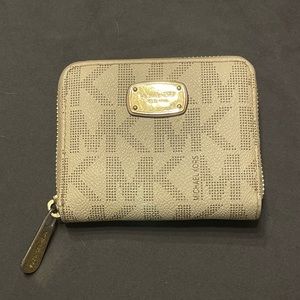 Monogram MK zip around wallet with coin pouch.